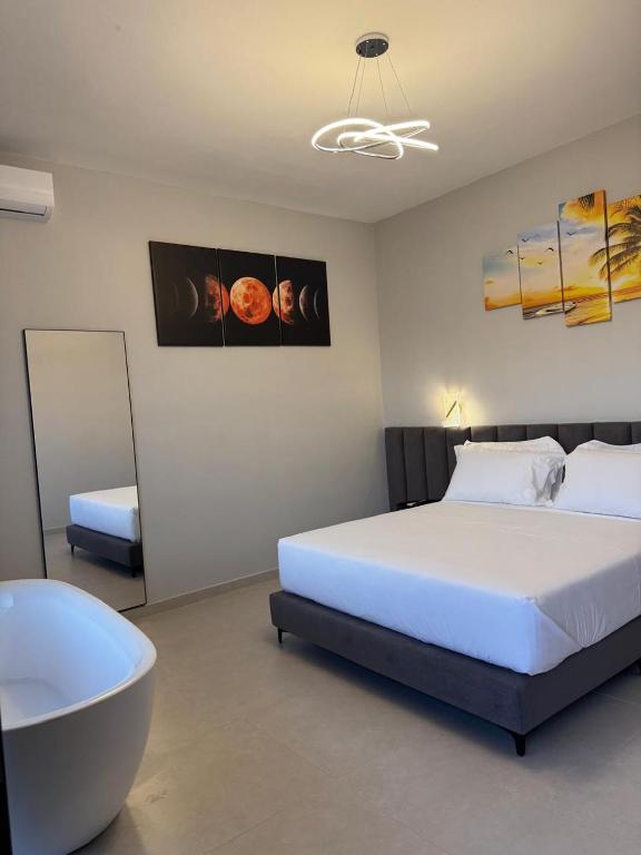 Postel nebo postele na pokoji v ubytování Aloha Villa and Suites