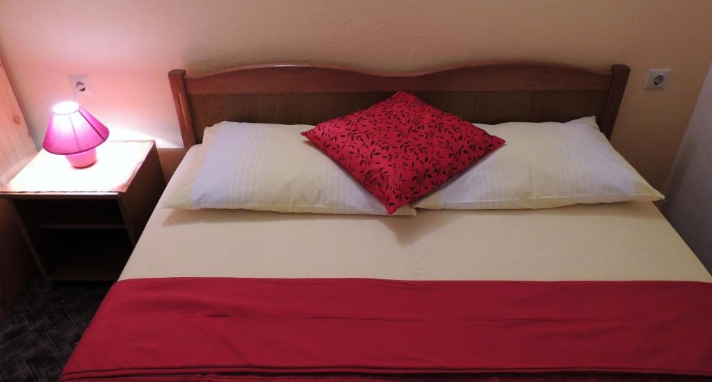 Postel nebo postele na pokoji v ubytování Apartments Vuleta