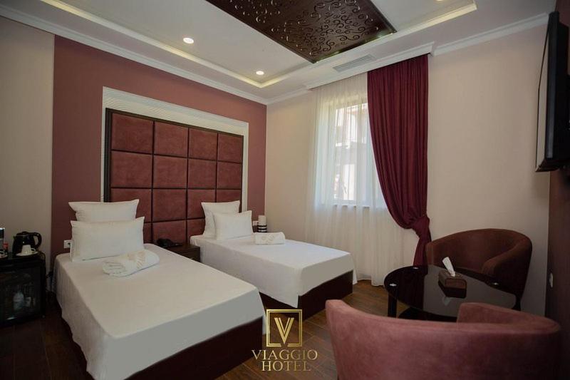 Postel nebo postele na pokoji v ubytování WIAGGIO Hotel