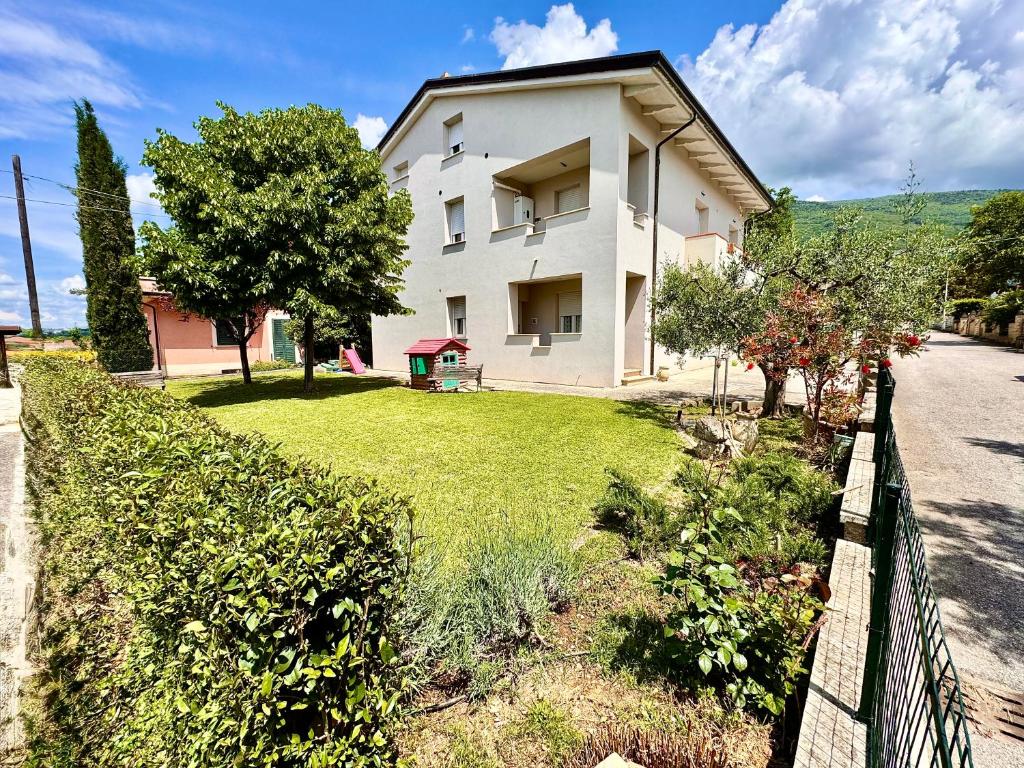 a white house with a fence in front of it at La Residenza dell'Arrotino in Capitan Loreto