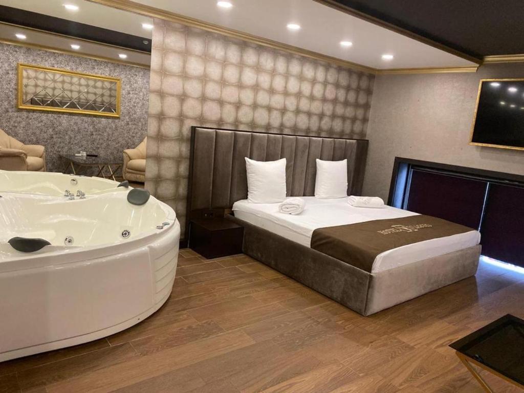 Postel nebo postele na pokoji v ubytování WIAGGIO Hotel
