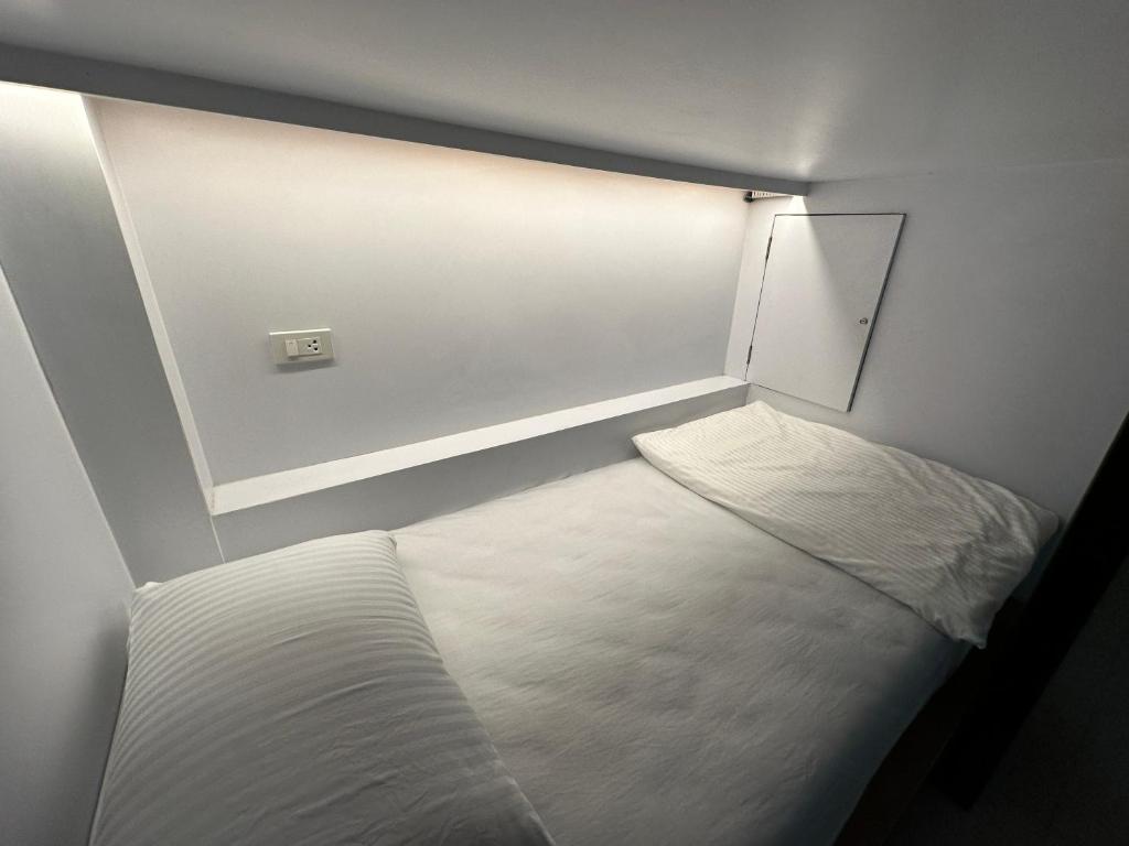 Postel nebo postele na pokoji v ubytování WANGTA Hostel