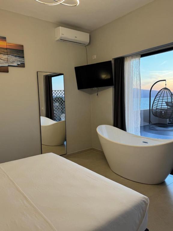 Postel nebo postele na pokoji v ubytování Aloha Villa and Suites
