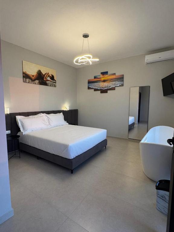 Postel nebo postele na pokoji v ubytování Aloha Villa and Suites