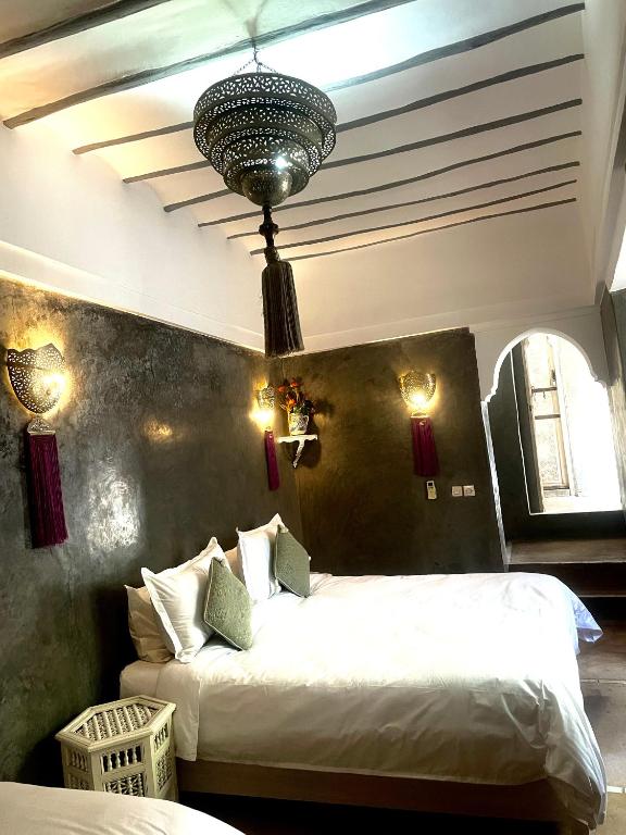 Postel nebo postele na pokoji v ubytování Riad Green Palm