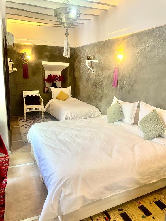 Postel nebo postele na pokoji v ubytování Riad Green Palm