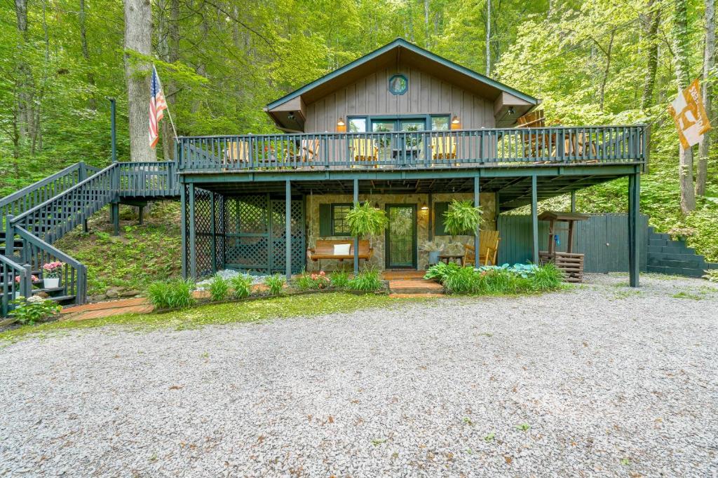a house with a deck and a porch at 'Bear Acres Getaway' Cabin w/ Deck in Townsend! in Townsend