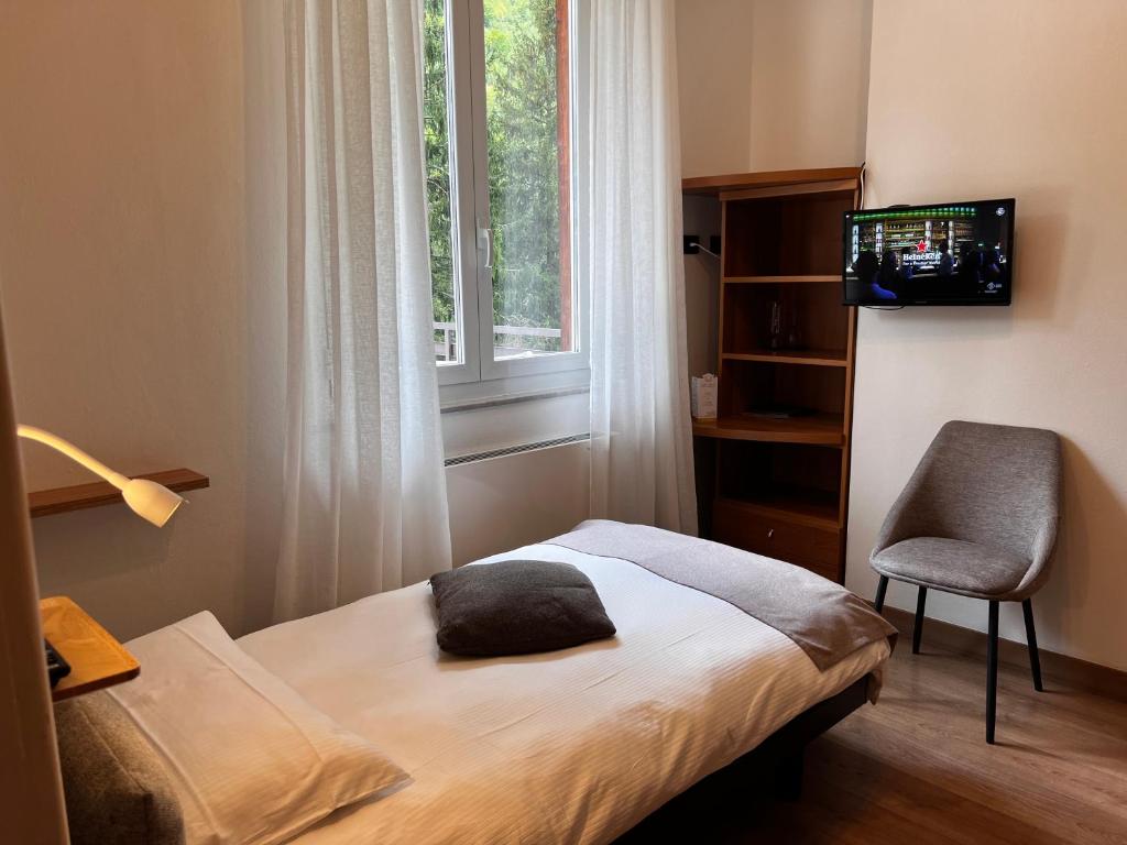 TV a/nebo společenská místnost v ubytování Albergo San Carlo