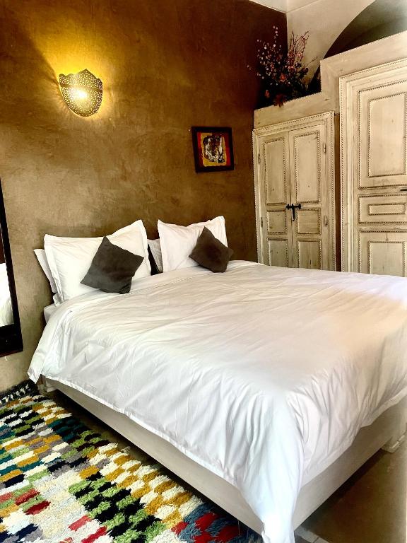 Postel nebo postele na pokoji v ubytování Riad Green Palm