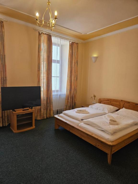 Postel nebo postele na pokoji v ubytování Hotel Barbarossa