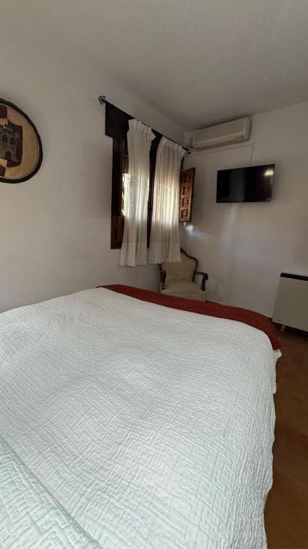 Postel nebo postele na pokoji v ubytování La Troje Oropesana