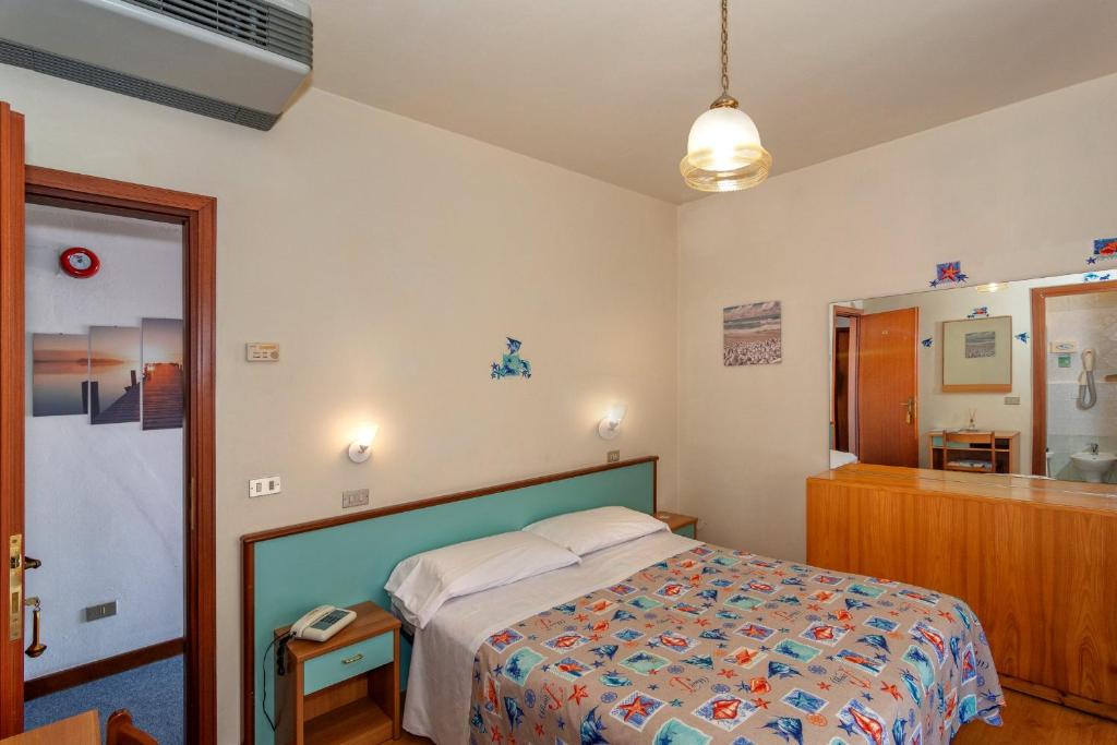 Postel nebo postele na pokoji v ubytování Hotel Mariani