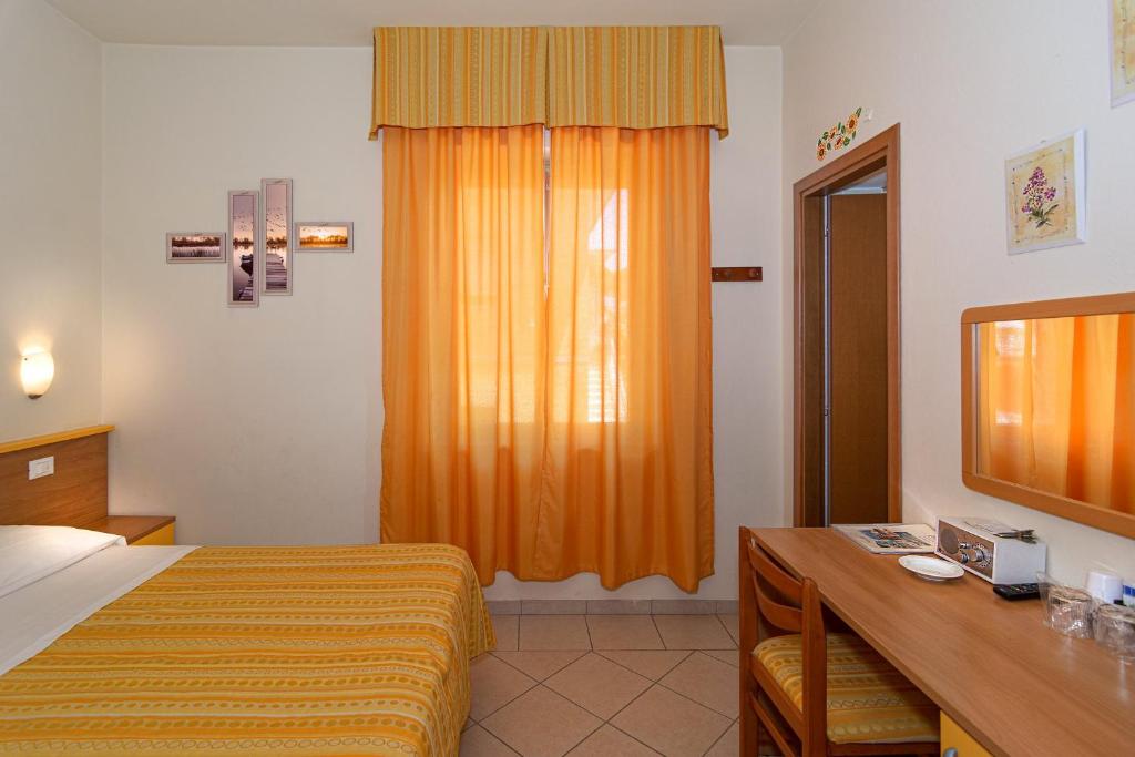 Postel nebo postele na pokoji v ubytování Hotel Mariani