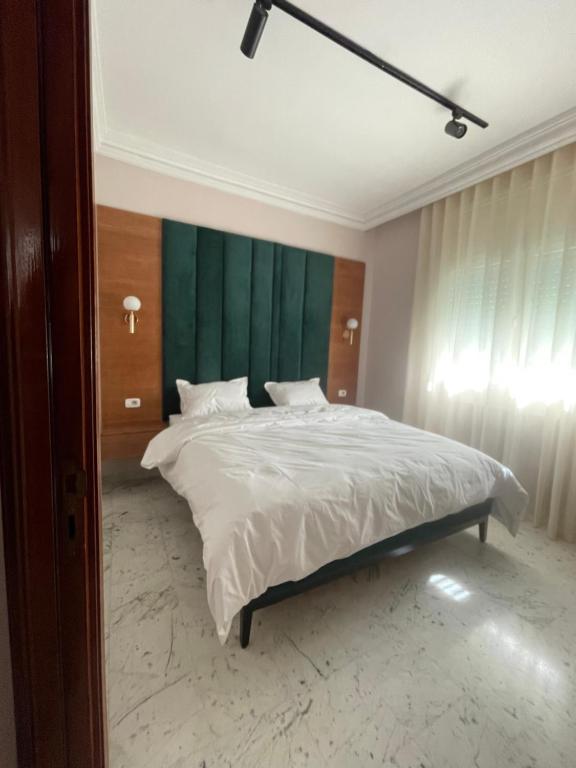 Postel nebo postele na pokoji v ubytování appart hotel lac 2 Tunis