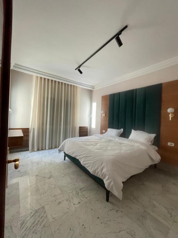 Postel nebo postele na pokoji v ubytování appart hotel lac 2 Tunis