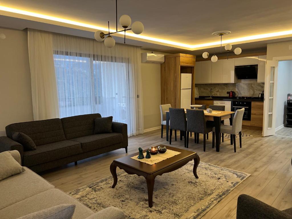 a living room with a couch and a table at My Trabzon trend house in Trabzon