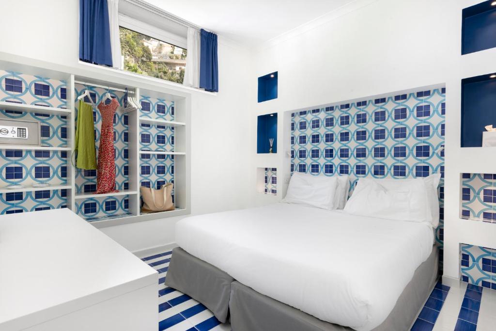 Postel nebo postele na pokoji v ubytování Hotel Bougainville