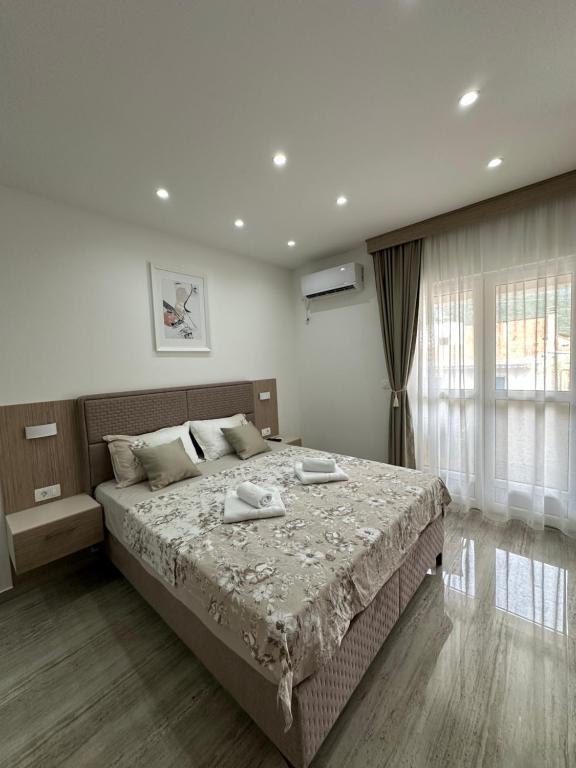 Postel nebo postele na pokoji v ubytování AS apartmani
