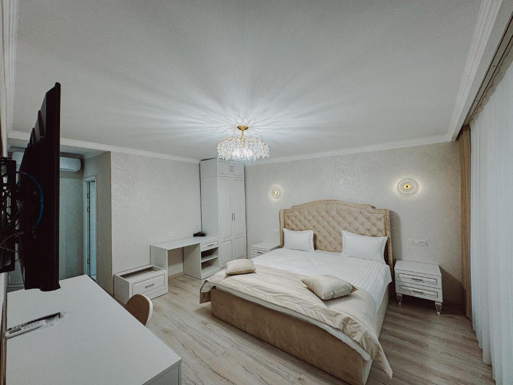 Postel nebo postele na pokoji v ubytování Old Yerevan Boutique Hotel