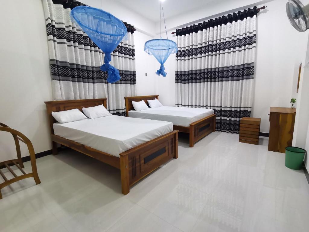 Postel nebo postele na pokoji v ubytování Ancient Breeze HomeStay