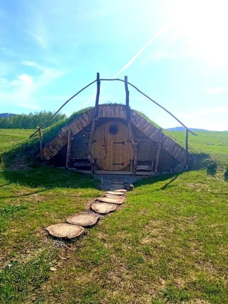 a large building in the middle of a field at Niesamowita Dolina in Zdonia