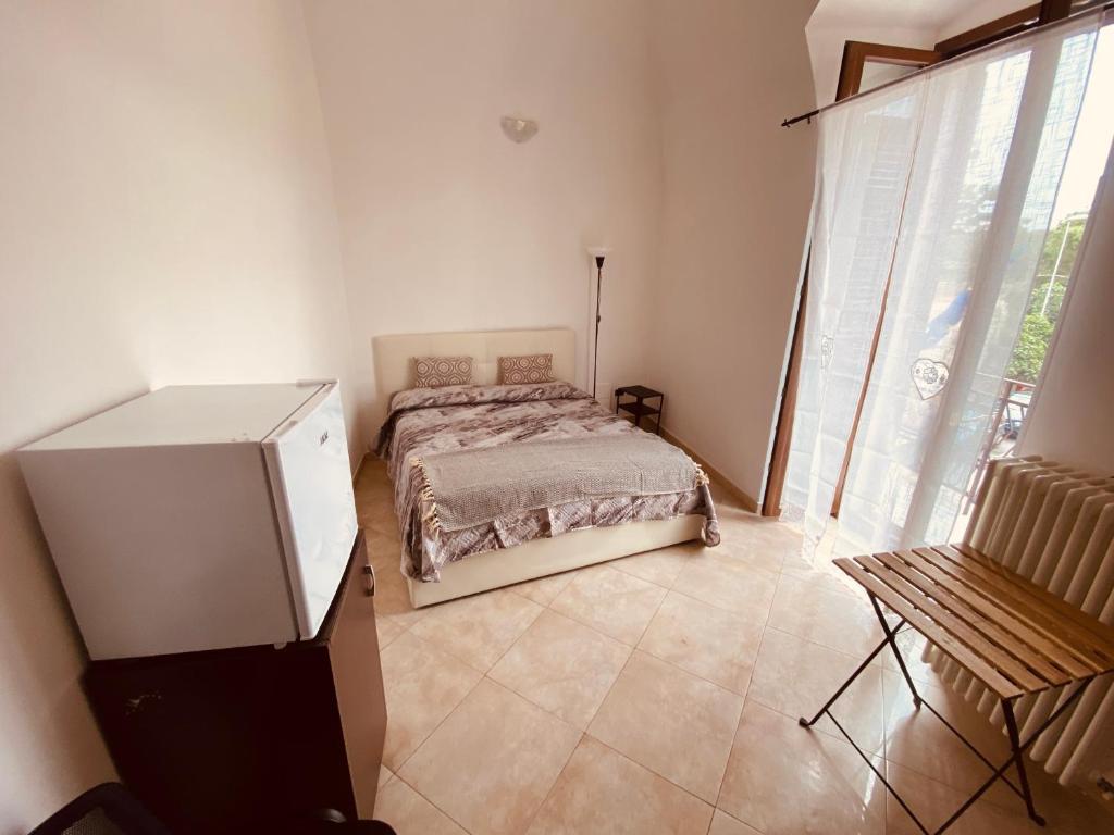 A bed or beds in a room at Palazzo Armony
