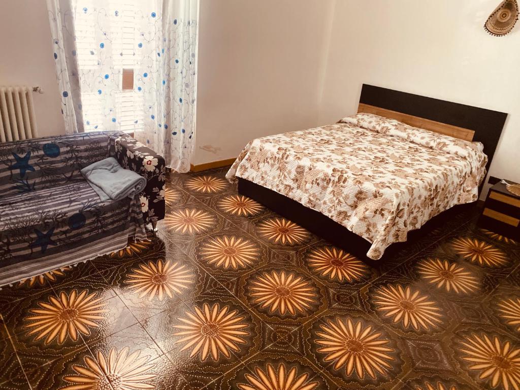 A bed or beds in a room at Palazzo Armony