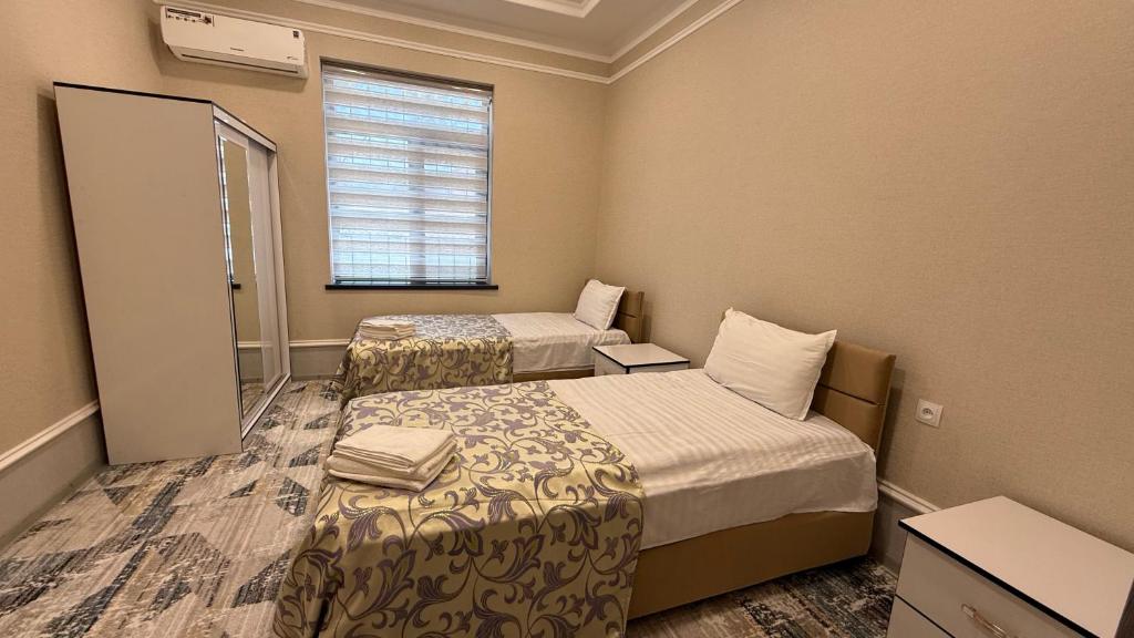 Postel nebo postele na pokoji v ubytování Billuri Sitora Resort