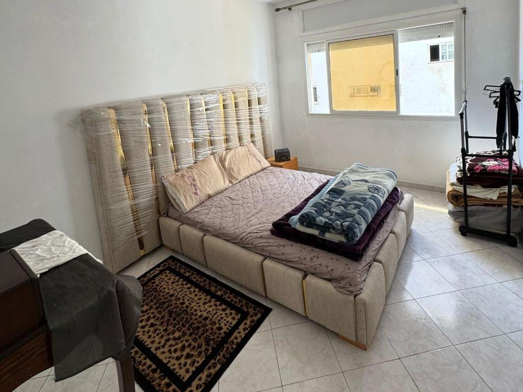 Un pat sau paturi într-o cameră la Appartement Dadi