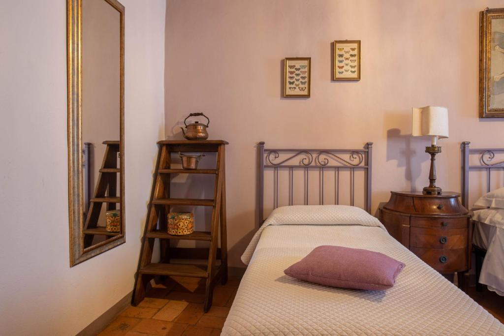 Postel nebo postele na pokoji v ubytování Guesthouse da Idolina dal 1946