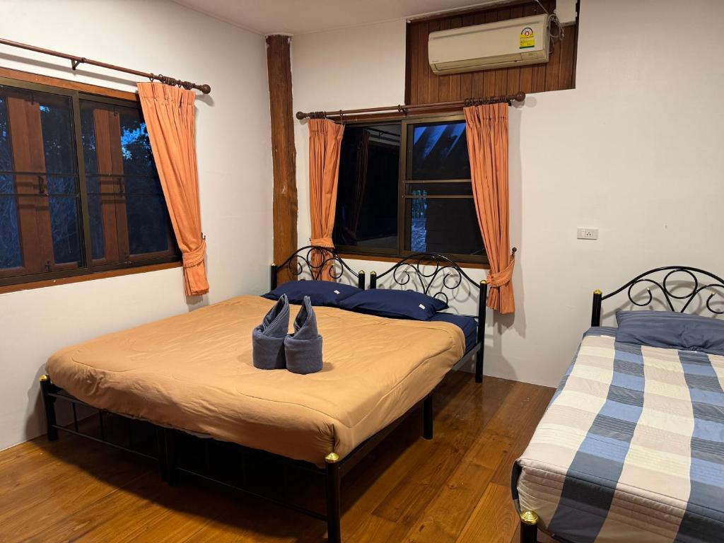 Postel nebo postele na pokoji v ubytování Shaya Homestay & Dorms