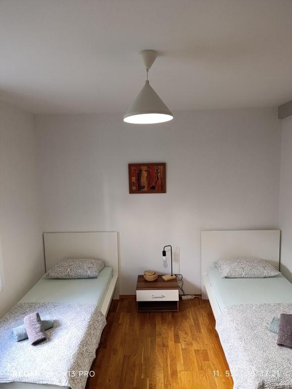 Posteľ alebo postele v izbe v ubytovaní Apartment M & M
