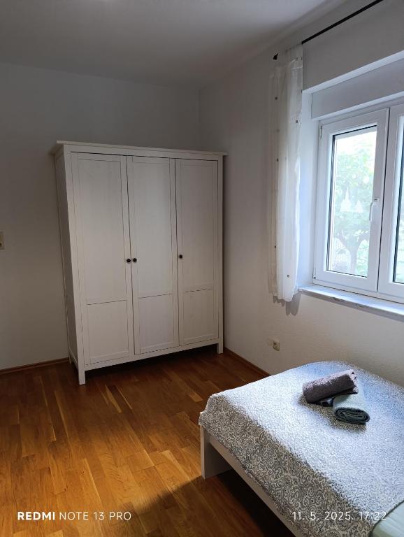 Posteľ alebo postele v izbe v ubytovaní Apartment M & M