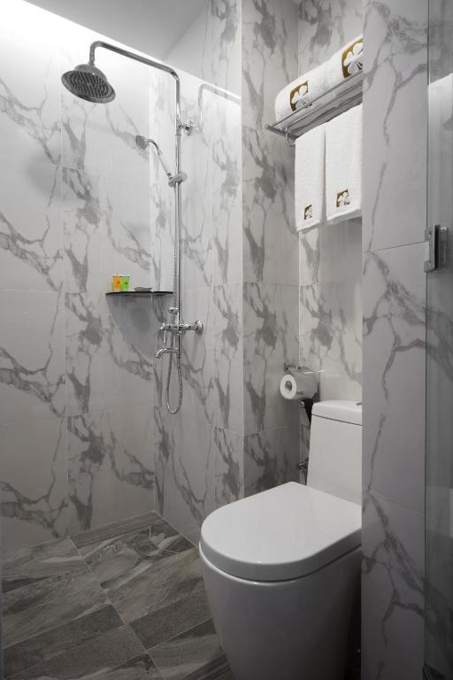 Koupelna v ubytování Hotel Clover 7