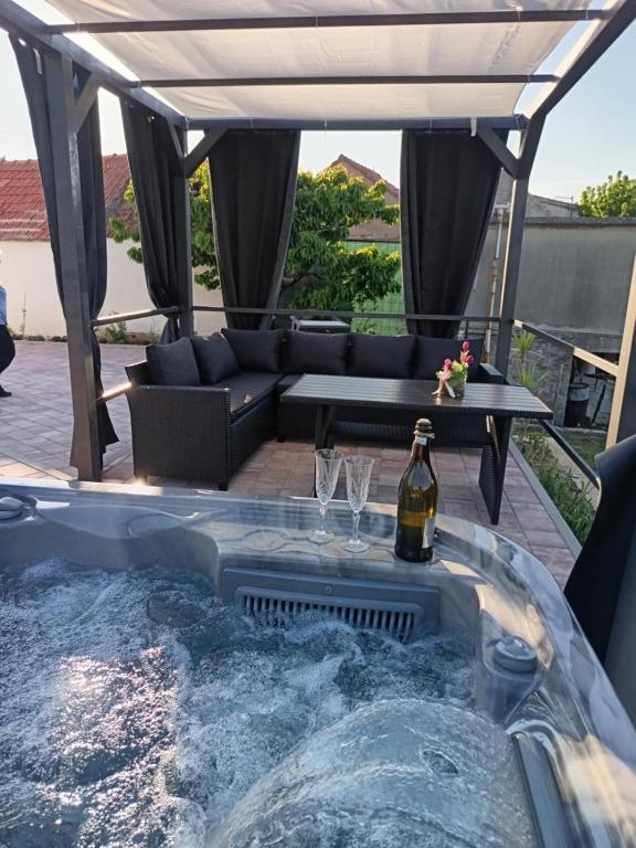 a hot tub in the middle of a patio at Emily in Slime