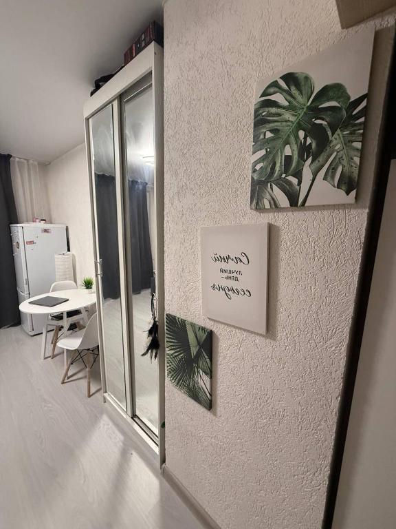 a living room with a sign on the wall at Family house near the beach 24 in Male City