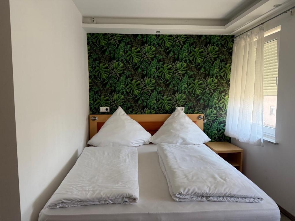Postel nebo postele na pokoji v ubytování CoBa Restaurant & Hotel