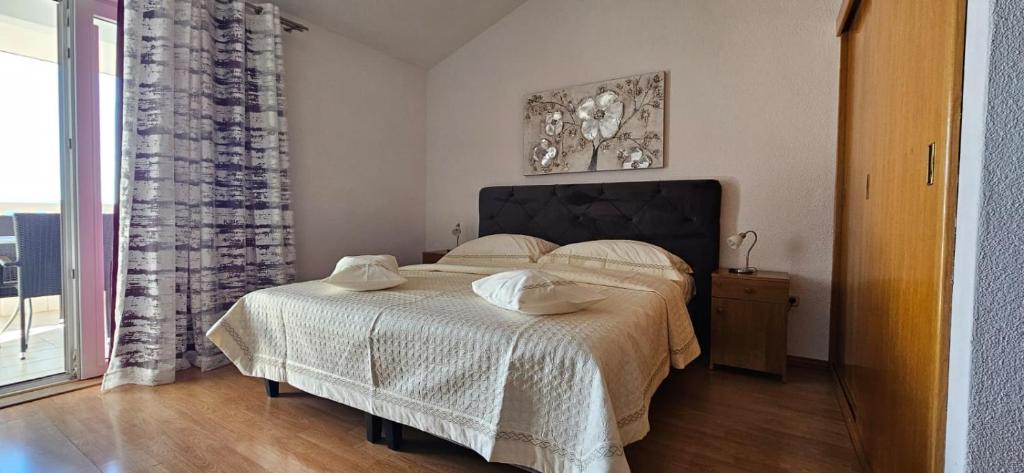 Postel nebo postele na pokoji v ubytování AS Brela
