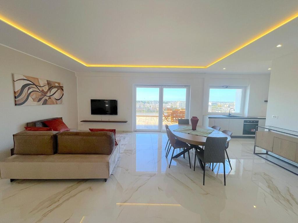 a large living room with a couch and a table at Rooftop Galatina in Galatina