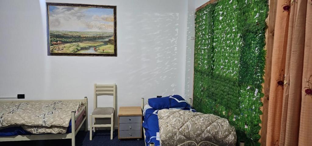 Postel nebo postele na pokoji v ubytování Stone House Hostel Elbasan