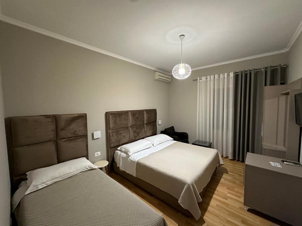 Voodi või voodid majutusasutuse Rooms Dionis toas