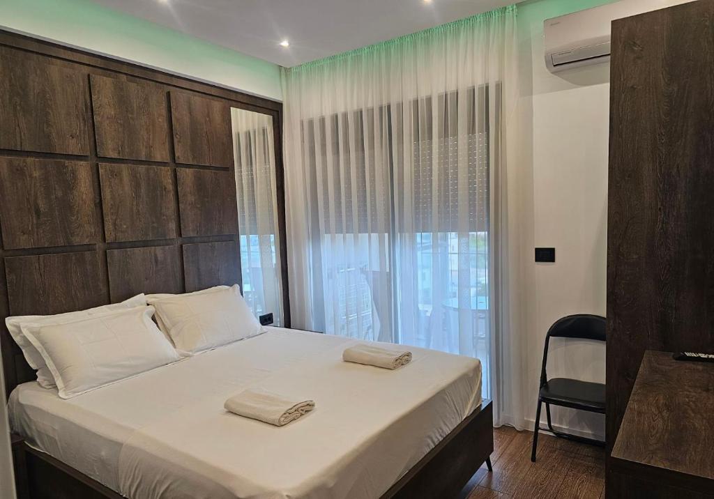 Postel nebo postele na pokoji v ubytování Moon Apartment