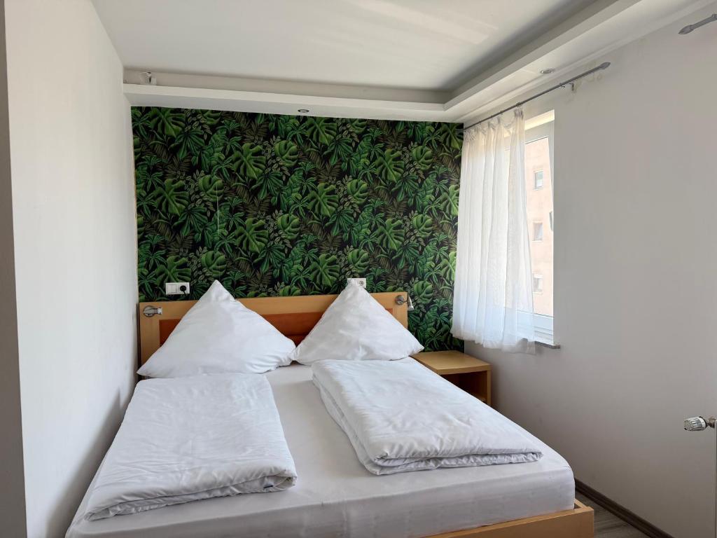 Postel nebo postele na pokoji v ubytování CoBa Restaurant & Hotel