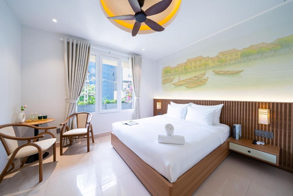 Giường trong phòng chung tại Sujet Residence Da Nang by Haviland