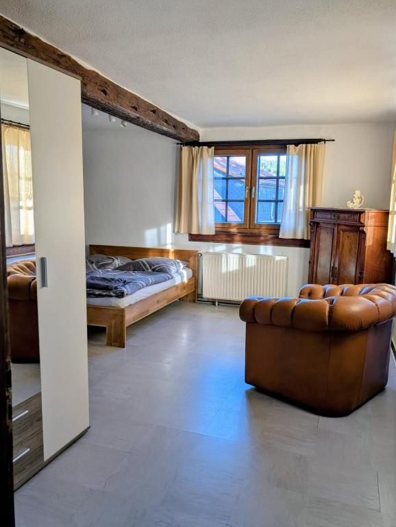 Postel nebo postele na pokoji v ubytování Ferienhaus Gesindestube Trusetal