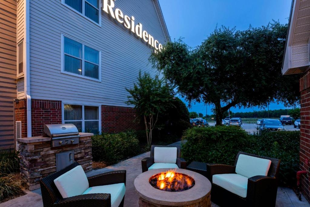 a fire pit in front of a building at Residence Inn by Marriott Monroe in Monroe