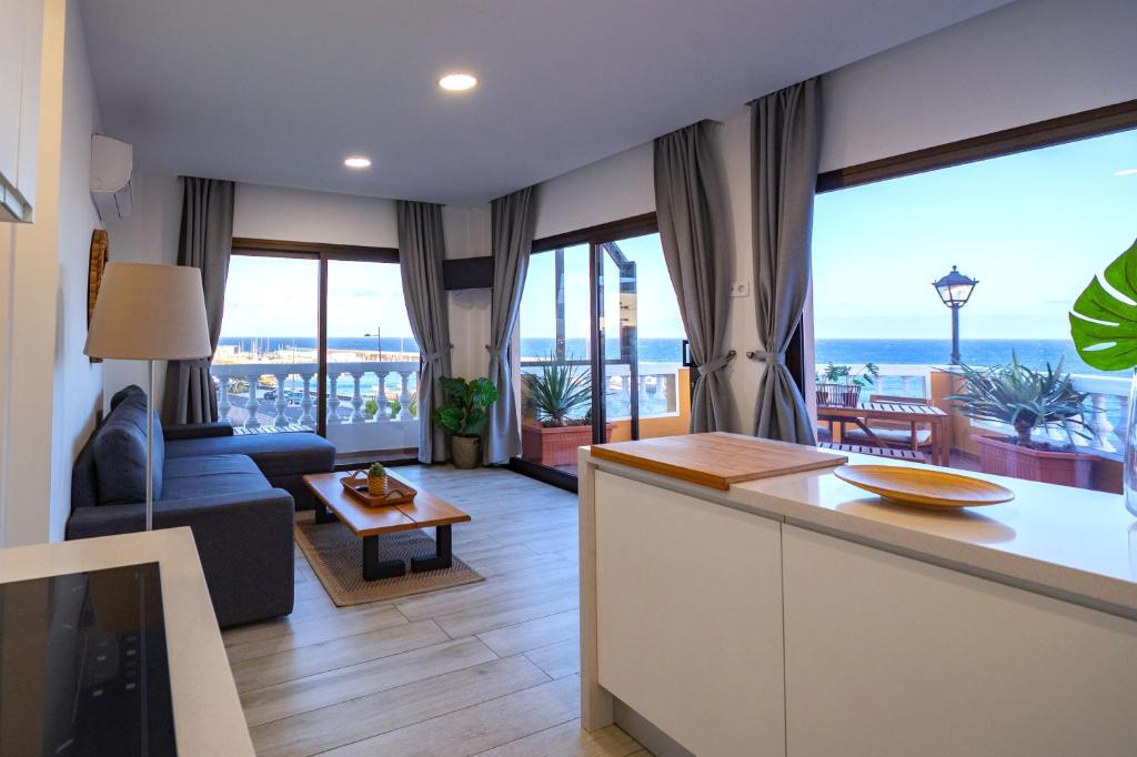 a kitchen and living room with a view of the ocean at ABLANCAS - La Restinga in La Restinga