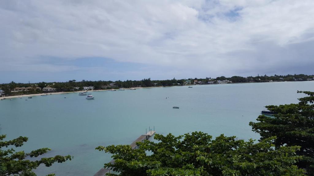 a large body of water with boats in it at Residenceticoco in Grand Baie