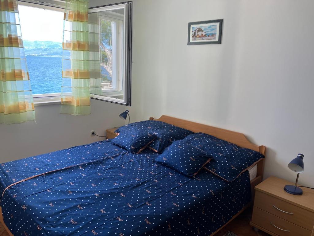 Postel nebo postele na pokoji v ubytování Apartment Andrea