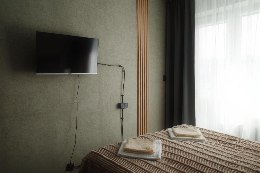 Postel nebo postele na pokoji v ubytování Guest Apartments Orłowo